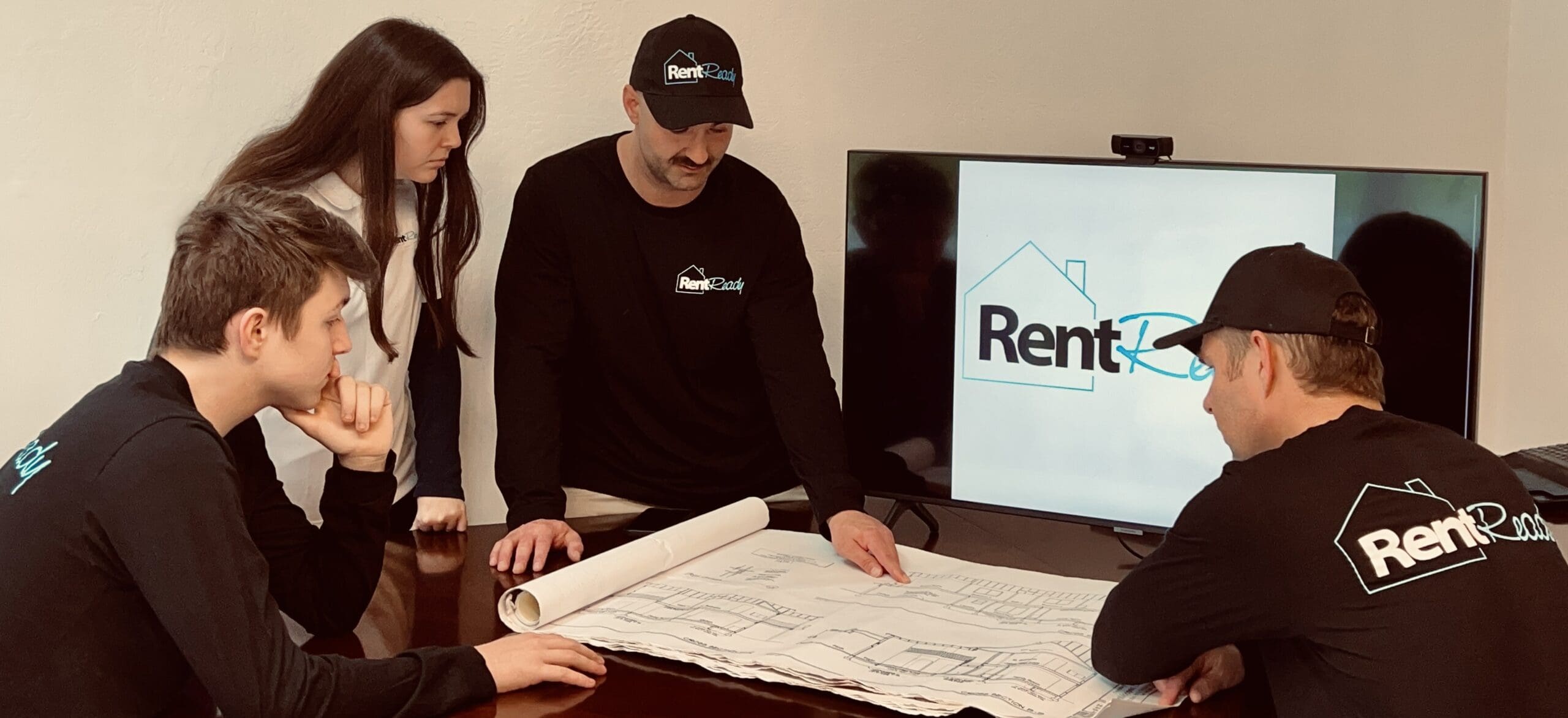 Rent Ready Team looking at schematics